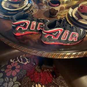 Red black and white Nike shoes